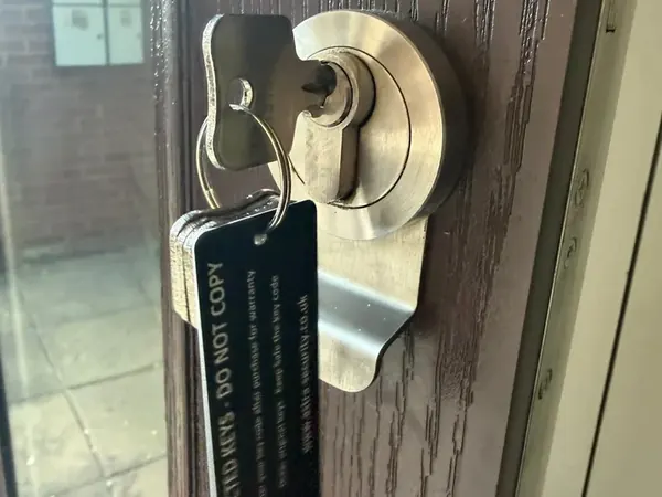 Euro cylinder with security escutcheon and restricted key tag