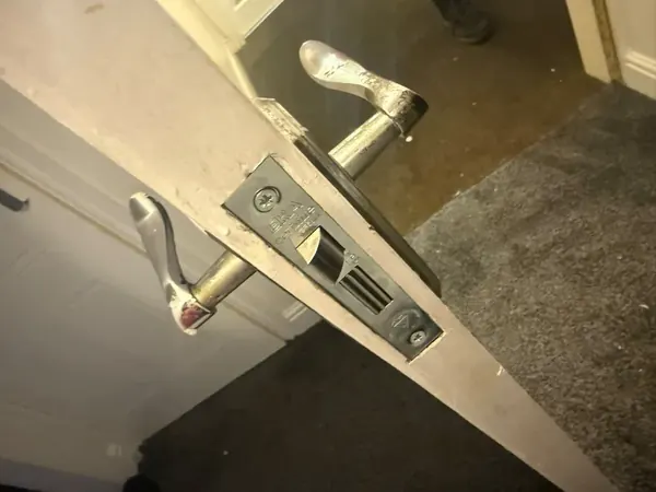 Mortice sashlock and lever handles fitted to a door edge