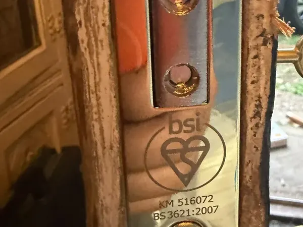 Kitemarked BS3621 mortice lock forend on a timber door frame